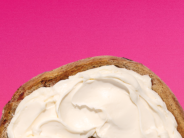 A croissant and A bagel with cream cheese